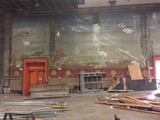 This is the first of a three-part panorama showing what remains of the underwater applique mural on the interior wall of the east auditorium.